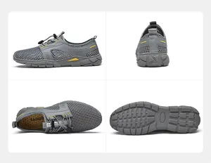 Gedetailleerd vierzijdig aanzicht van grijze ademende mesh herensportschoenen met rubberen zool.