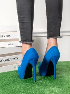 Detailed rear view showing the royal blue suede platform stiletto pumps with ultra high heels