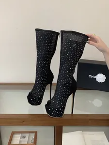 Detail of black mesh peep-toe high heel boots with sparkling rhinestone accents