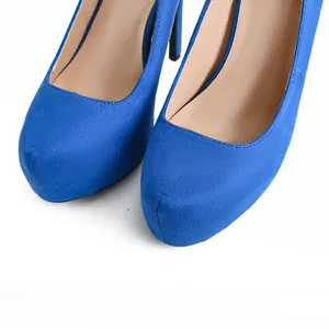 Macro detail view of elegant royal blue suede platform pumps featuring a classic round toe
