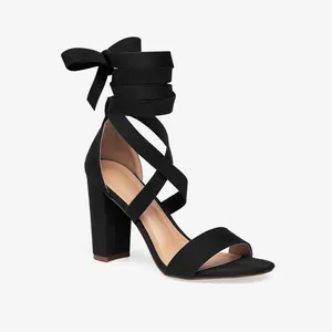 Side view of elegant black block heel sandals with crisscross ankle lace-up straps