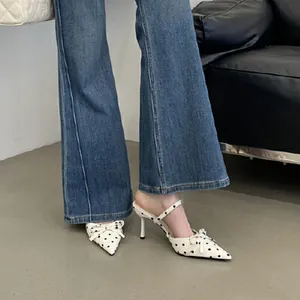 Elegant French style polka dot high heel mules featuring bow knot and pointed toe.