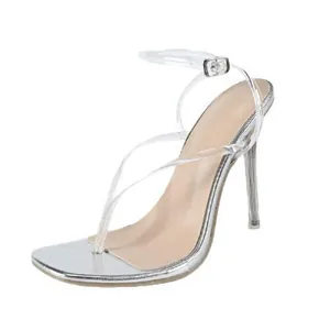 Elegant silver thong sandals with transparent straps and clear stiletto heels.