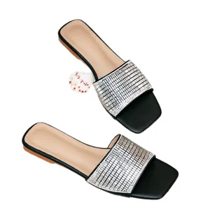 Chic black square-toe flat sandals featuring shimmering silver rhinestone straps for summer