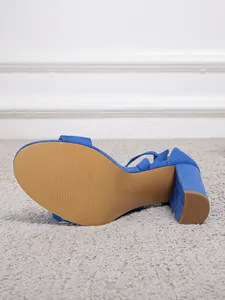 Detailed view of the royal blue suede chunky heel sandal sole and size marking
