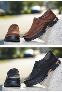 Dettaglio scarpe outdoor in pelle marrone e nera con design traforato e suole spesse