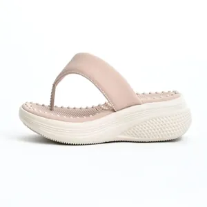 Detail side view of women's platform flip-flops with massage footbed and thick soft sole.