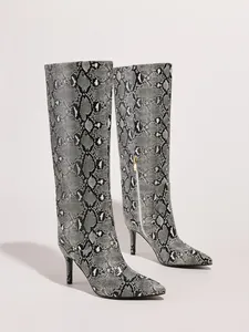 Stylish snakeskin print knee-high boots featuring pointed toe and slim stiletto heel