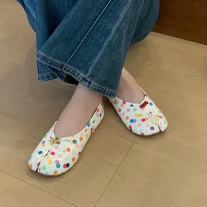 Stylish colorful polka dot split-toe Tabi flat shoes for women with vibrant patterns