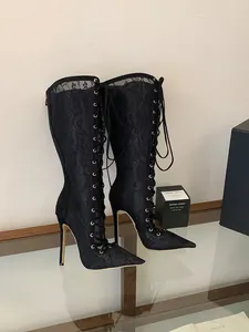 Elegant black lace-up mesh high-heeled boots with stiletto heels and pointed toe detail