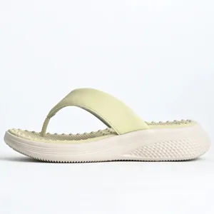 Side view of women's platform flip-flops with massage footbed in pale yellow