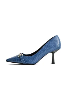 Side view detail of blue crocodile-embossed pointed toe stiletto pump with buckle
