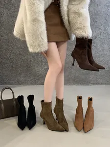 Detailed view of pointed toe stiletto ankle boots in various colors with back zippers