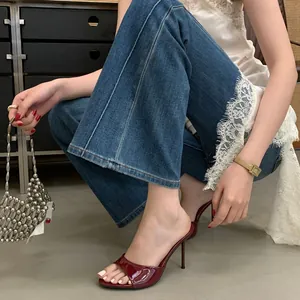 Elegant deep red glossy stiletto mules for women featuring a stylish summer outfit detail view
