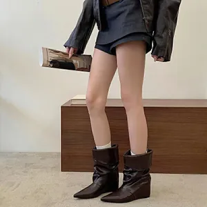 Stylish brown wedge mid-calf boots with pointed toe and slouchy folded design.
