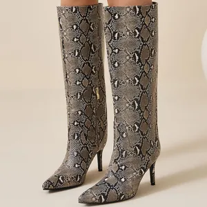 Stylish snakeskin pattern knee-high boots with stiletto heels and pointed toes for winter.