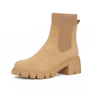 Side view of tan Chelsea boot with knitted ankle collar and chunky lug sole