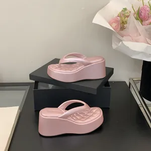 Elegant pink pearlescent platform flip-flops with stylish quilted insoles for summer