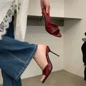 Elegant wine red patent leather stiletto sandals with open-toe design for summer.