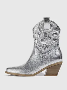 Detailed side view of a metallic silver western cowboy boot with intricate embroidery