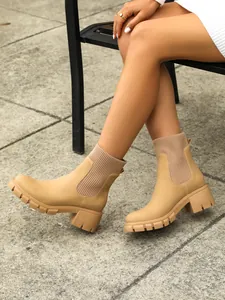 Stylish beige Chelsea boots with knitted shaft and chunky platform heel