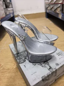 Detailed view of silver 15cm high heel sandals with thick platform and transparent straps