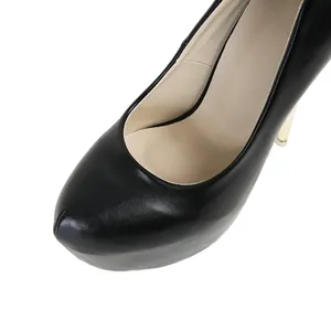 Close-up of black platform high heels with smooth leather finish
