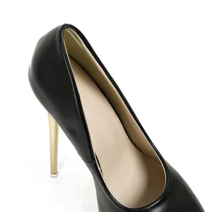 Detailed view of elegant black stiletto high heels with golden heel and platform