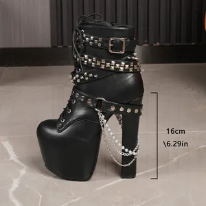 Detailed view of black 16cm platform boots featuring silver studs and chain decor
