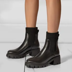 Stylish black platform Chelsea boots with chunky heel and knit sock design for women