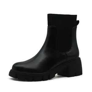 Women's black Chelsea ankle boots with knitted cuff and chunky lug sole