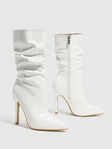 White patent leather mid-calf slouchy boots with pointed toe and stiletto heel