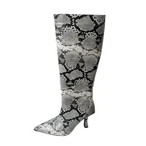 Knee-high boot featuring pointed toe and kitten heel with grey snakeskin texture.