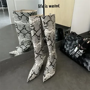 Detail showing chic grey snakeskin pattern on pointed toe stiletto knee-high boots