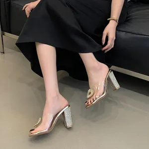 Elegant transparent PVC sandals with rhinestone buckle and block heel details