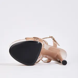 Detail view of the black anti-slip sole and stiletto heel of 17cm nude platform sandal.