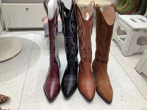 Showcasing four colors of Western-style pointed-toe tall boots with decorative stitching