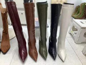 Vintage crocodile embossed pointed toe knee high boots displayed in multiple color options