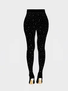 Rear view showing the rhinestone pattern on black pant boots with sleek stiletto heels.