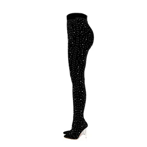 Side view of shimmering black rhinestone trouser boots featuring a slim stiletto heel
