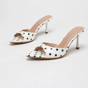 Stylish white polka dot open toe mule sandals with elegant stiletto heels for women