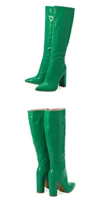 Green crocodile embossed patent leather knee-high boots with pointed toe and block heel