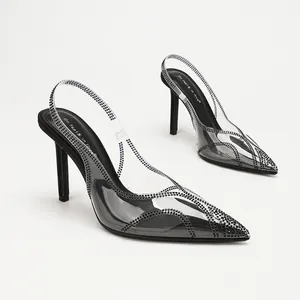 Elegant transparent PVC pointed toe slingback heels with sparkling rhinestone accents.