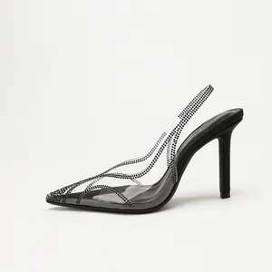 Elegant transparent PVC slingback high heels featuring black rhinestone wave patterns