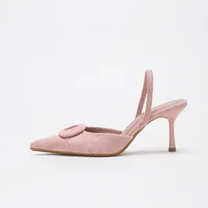 Elegant pink suede pointed-toe slingback pumps with round buckle detail and slim stiletto heel