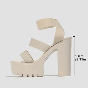 Side view of beige platform sandal with 13cm high block heel and elastic straps
