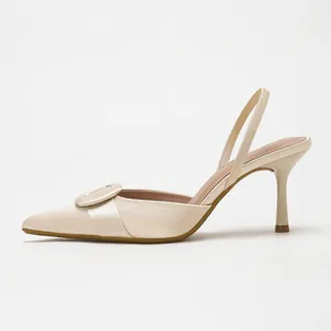 Elegant champagne satin pointed-toe slingback stiletto heels featuring a stylish buckle.