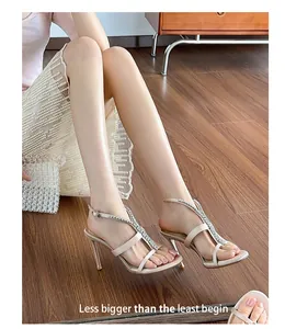 Detailed view of elegant rhinestone chain high-heeled sandals for summer evening wear