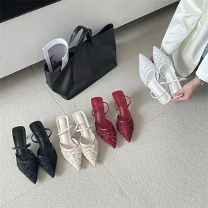Elegant pointed toe mesh embroidered mules in multiple colors with slim kitten heels.
