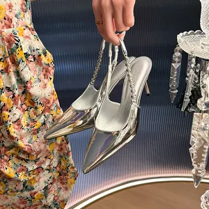 Elegant silver mirror-finish high heels with rhinestone chain straps and pointed toe